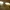 Sunlight beams through two large holes in the roof of a rocky cave.
