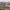 Panoramic view of Jerónimos Monastery with city buildings in the background.
