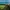 Soccer field on a cliffside overlooking the sea near a coastal town