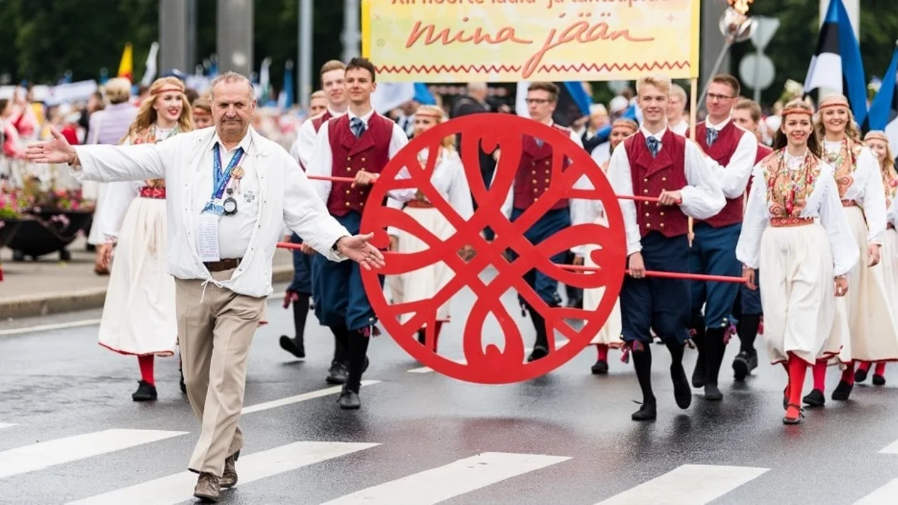 Singers and dancers wind their way through Tallinn during the procession, Estonia
