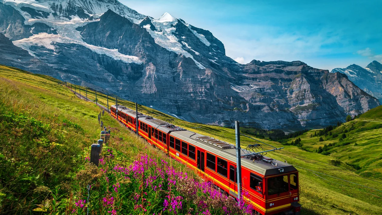 Cogwheel,Railway,With,Electric,Red,Tourist,Train.,Snowy,Jungfrau,Mountains