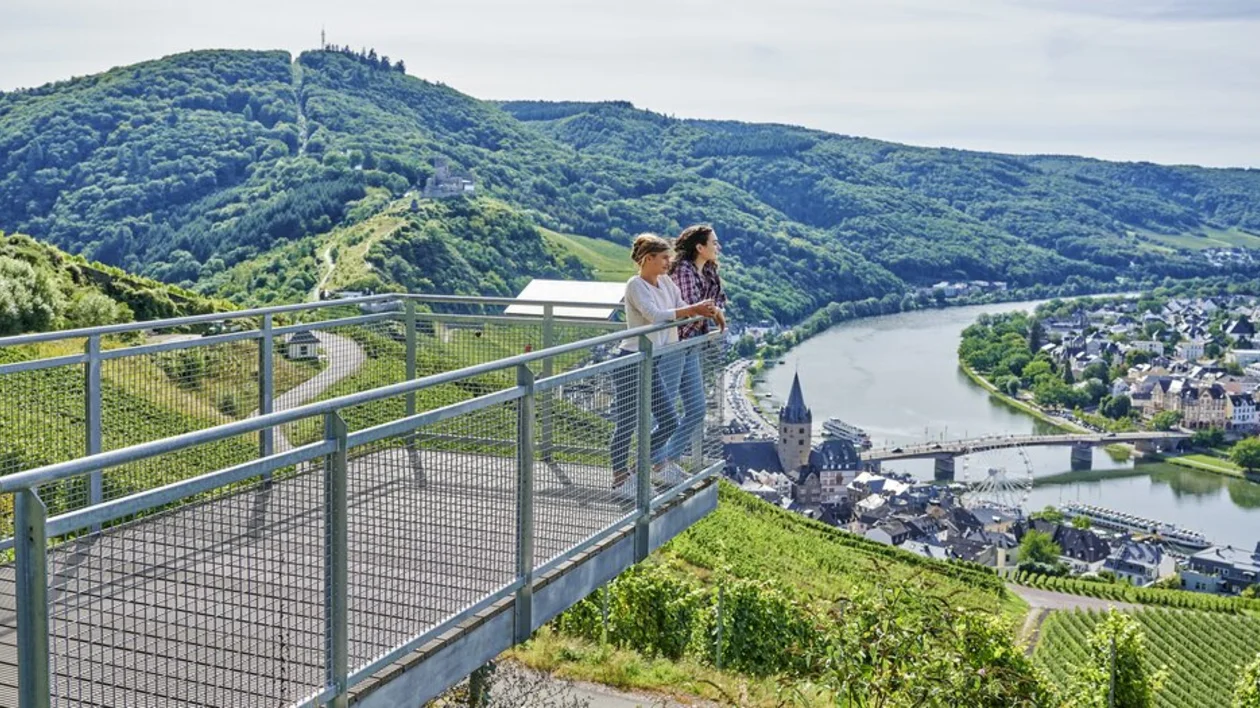 Two women starring the green scenario in Germany from a sightseeing point.
