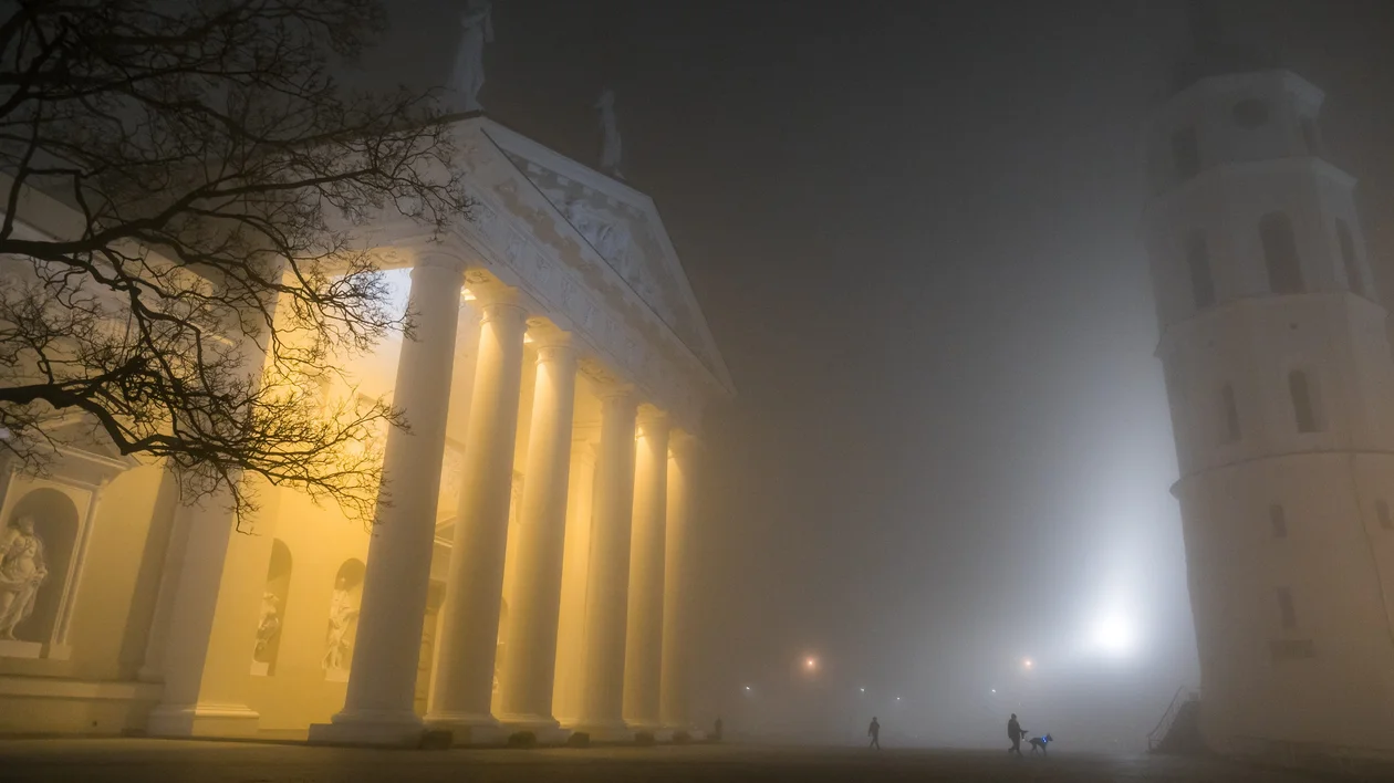 Vilnius Cathedral in Autumn surrounded by night fog..