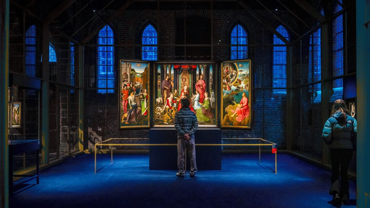 St. John’s Church (Sint‑Janskerk) in Mechelen, Belgium, a Gothic church with a high tower and rich historical architecture.