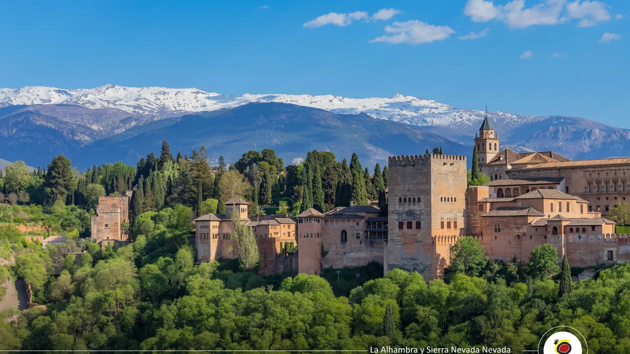 Alhambra palace with Sierra Nevada mountains in Granada, Spain.