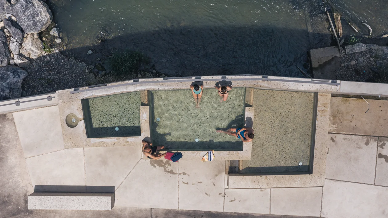 Aerial view of people relaxing in outdoor thermal baths in Baden