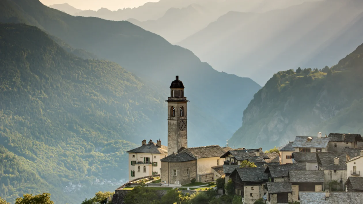 Alpine village of Soglio with church tower and mountain valley views