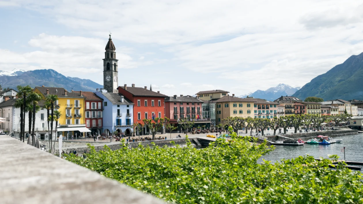 Colorful lakeside promenade and church tower in Ascona, Switzerland