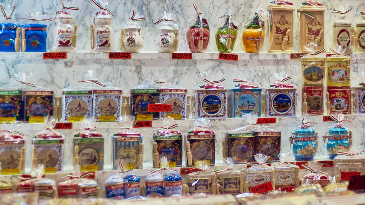 Shelves stocked with bags and boxes of colorful Italian pasta varieties.