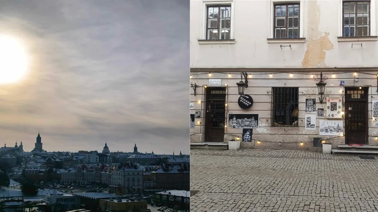 City skyline under a cloudy sun on the left; cobbled street and building facade on the right.