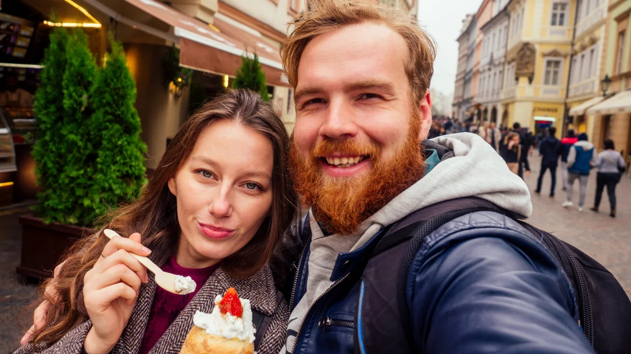 Traditional Czech sweet Trdelnik with vanilla cream and strawberries.
