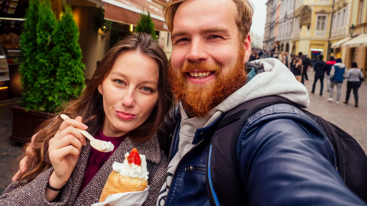 Traditional Czech sweet Trdelnik with vanilla cream and strawberries.