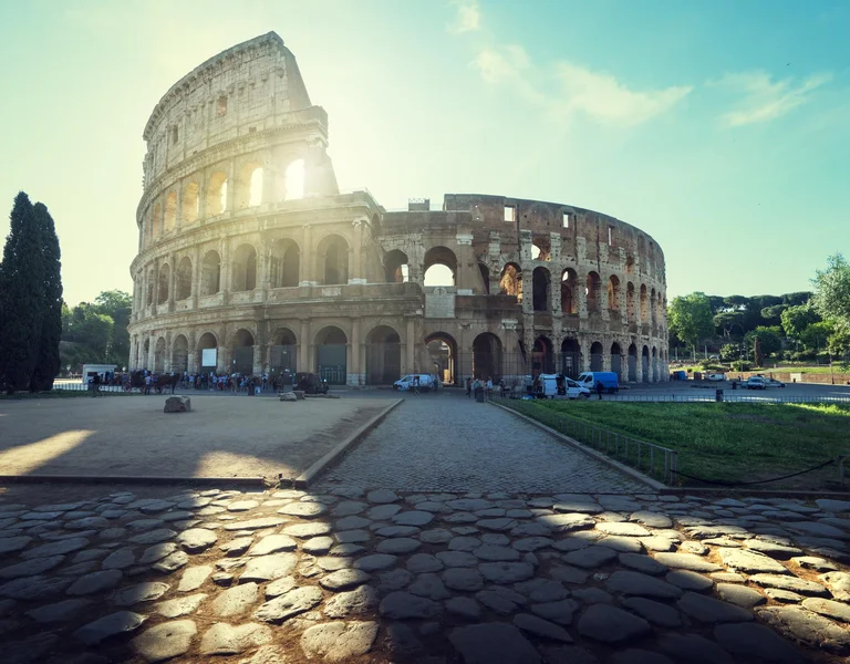 Colosseum in Rome and morning sun.