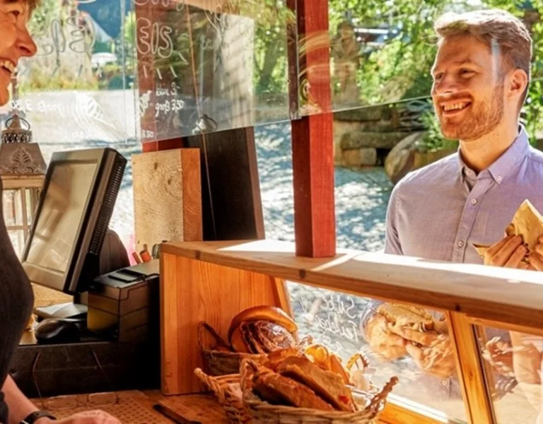 Conversation at local food market, Germany.