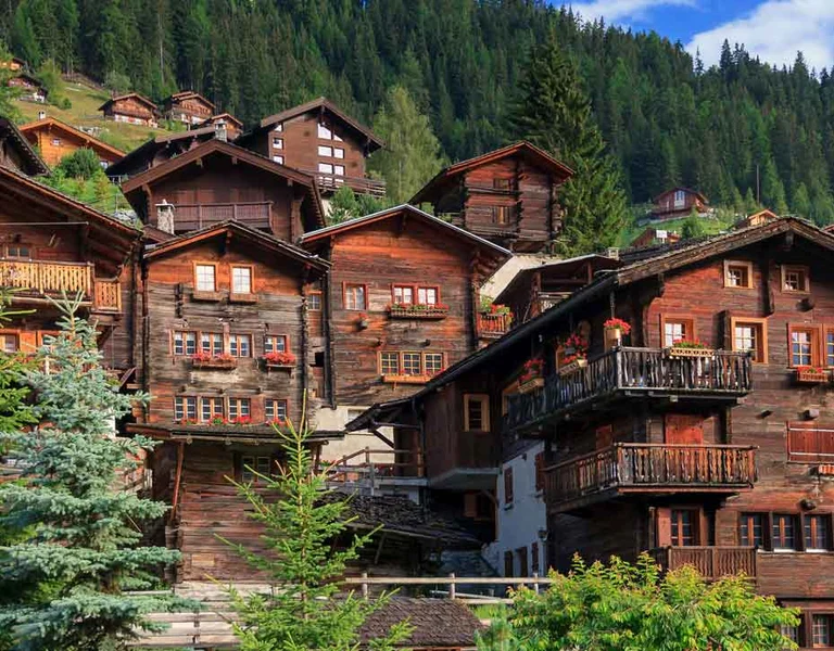 Alpine village with traditional wooden houses in Valais.