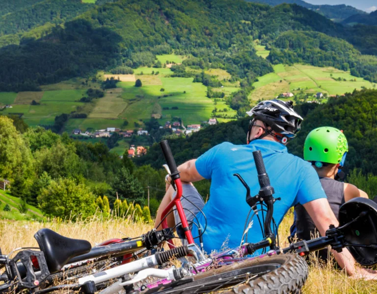 family enjoying a summer days in the hills after biking