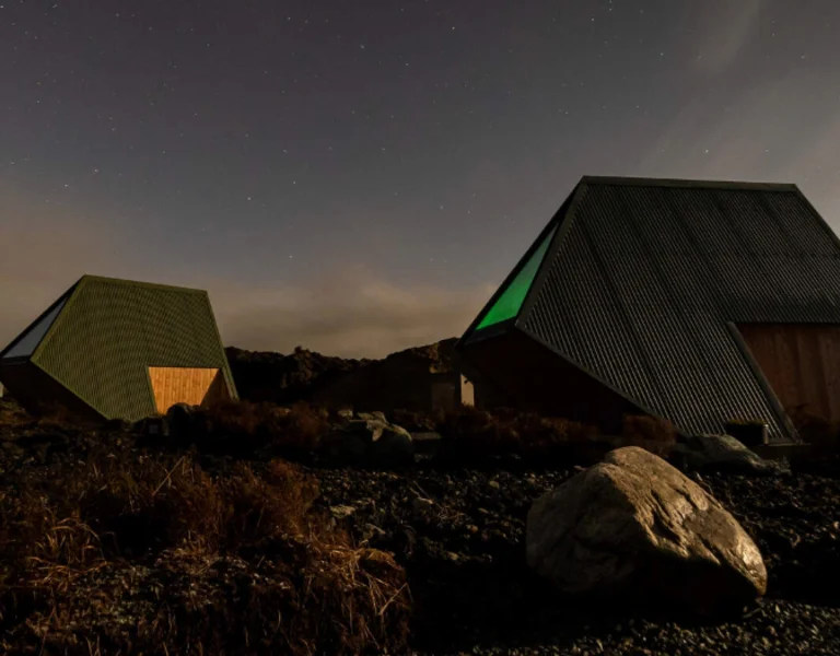 Nigh and Irish surroundings. There is a tent and a person sleeping.