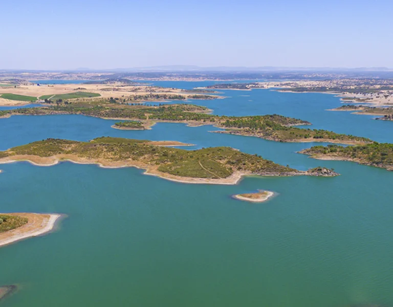 Aerial panorama of Alqueva Lake dotted with small islands.