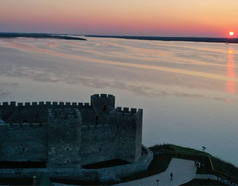 Sunset view of Ram Fortress with the Danube River in the background.