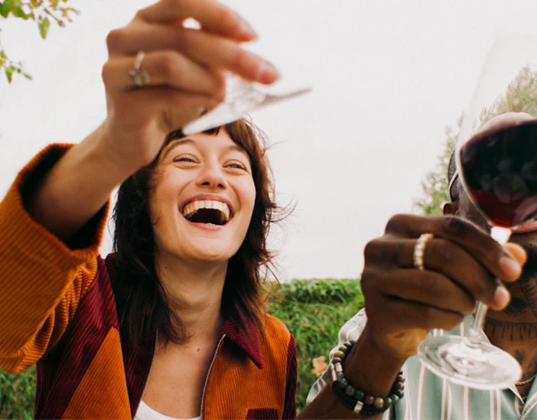 Girl toasting with a glass of wine in Austria.