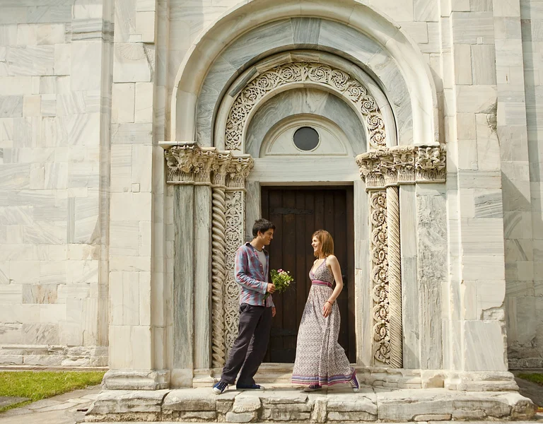 Visitors standing at the entrance of Studenica Monastery in Serbia