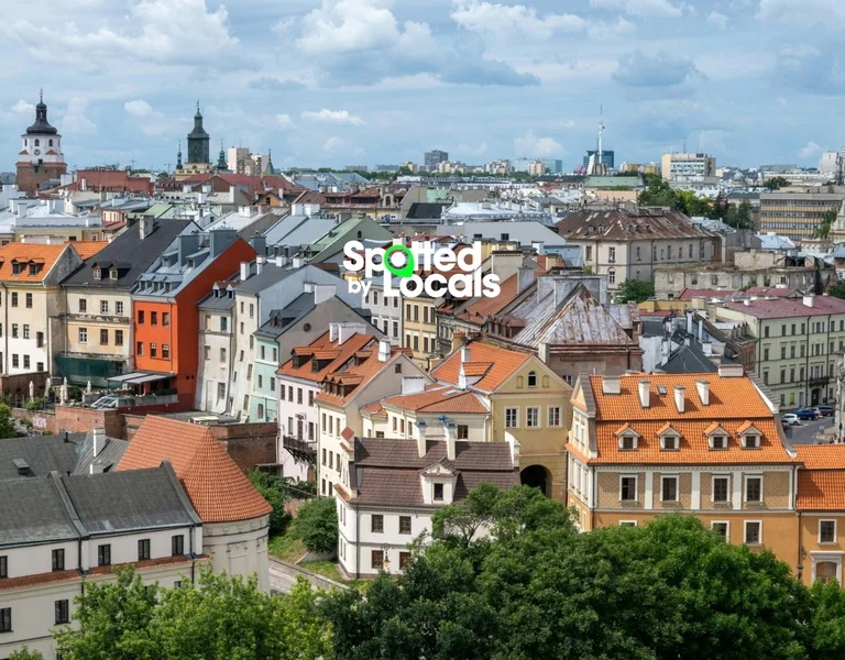 Colorful cityscape with historic buildings and cloudy sky