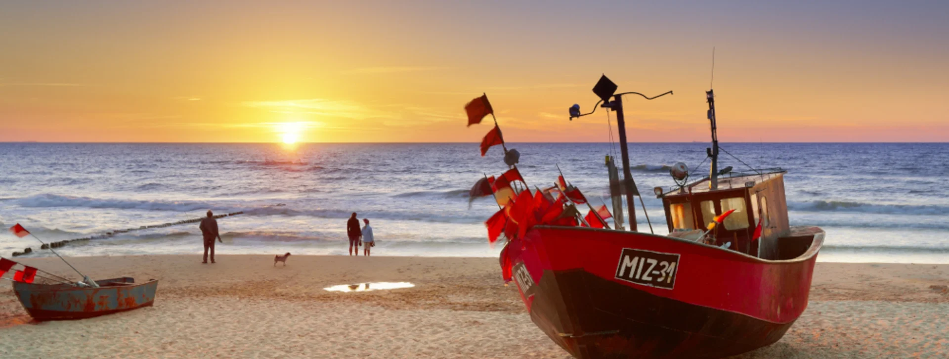 Cheerful, colorful boats on the beach in Miedzyzdroje will make for super photos of your trip.