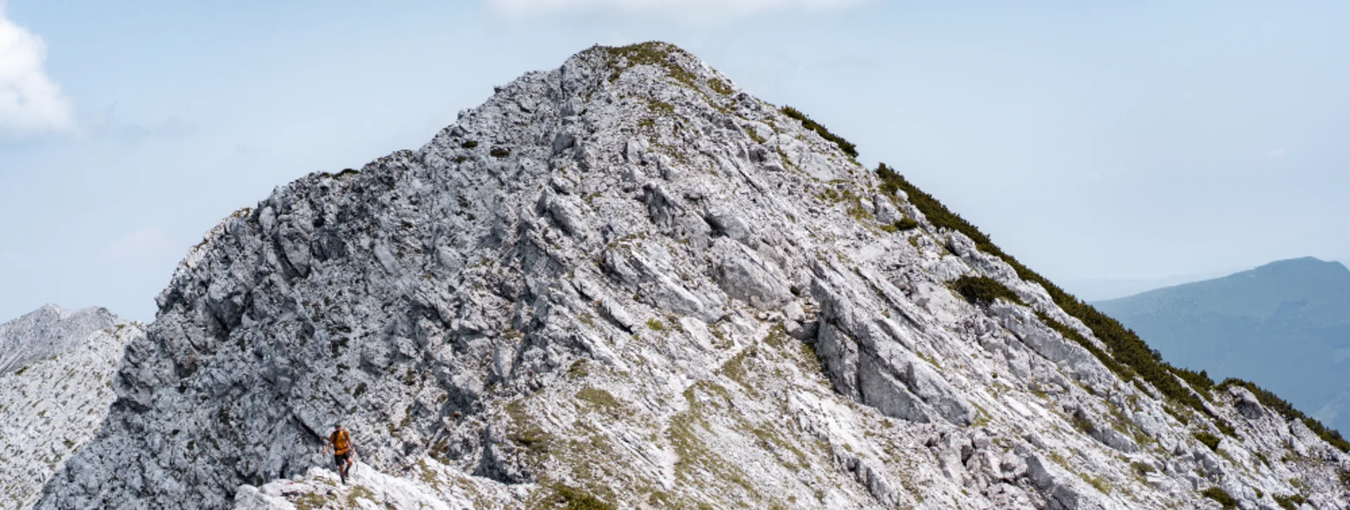 A peak mountain in Slovenia with a clear blue sky.