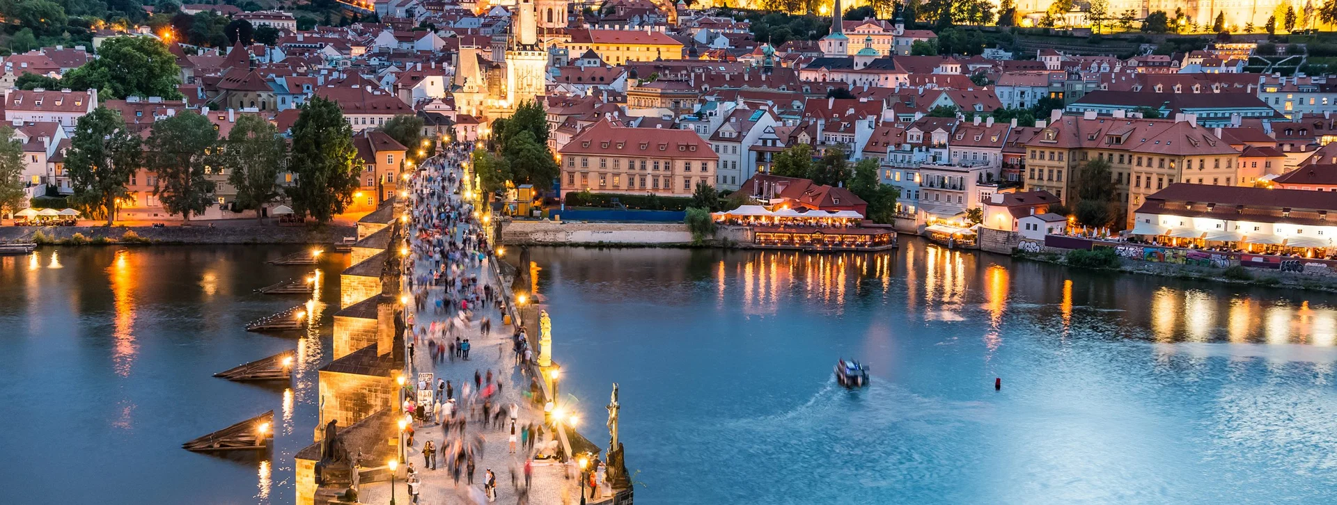 Prague, Charles bridge at the sunset panoramic view.