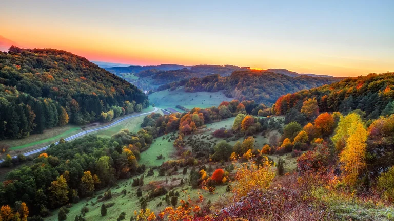 Idyllic Autumn Scenery with Colorful Orange Golden Trees near a lovely Jura Mountains of Bavaria