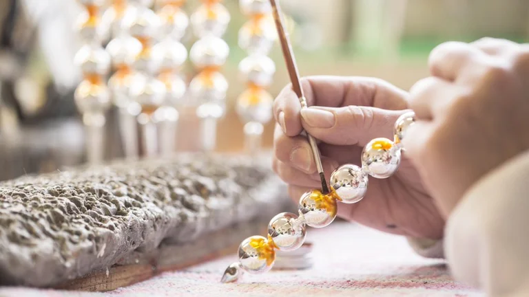 Making glass beads at the Rautis Glass Factory in Poniklá