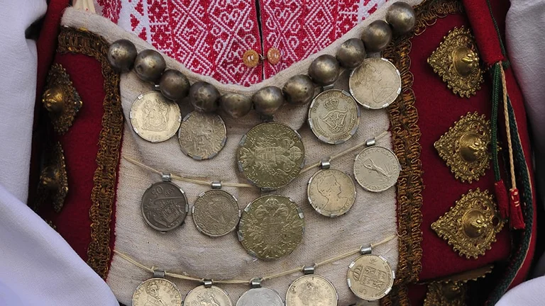 You can sometimes hear the coins on the women's traditional costume in the Dalmatian hinterland, Croatia
