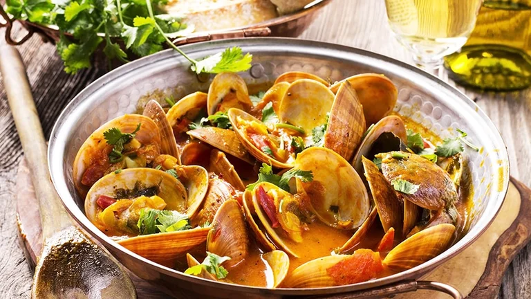 Linger over seaside cuisine in Cataplana, Portugal