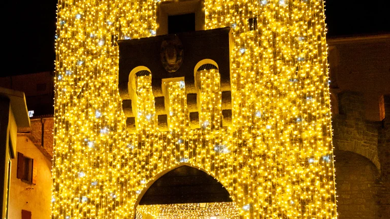 Visit the Saint Francis Gate at nighttime for a gorgeous sight