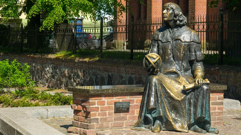 Take a break while you admire the Nicolas Copernicus Monument.