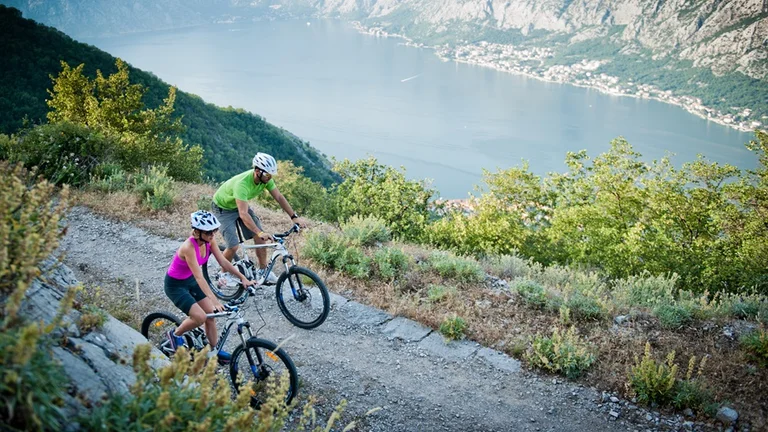 biking in Montenegro mountains over a lake