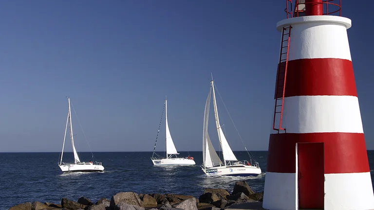 See top competition teams breeze by the Farol de Portimão as they train.