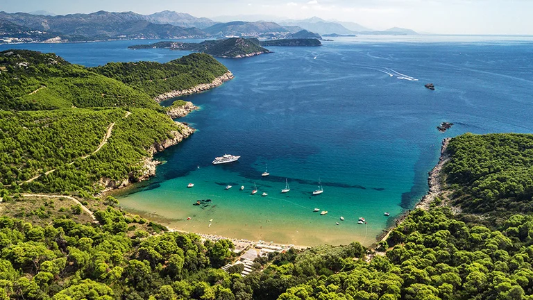 Fill your eyes with nature's jewel tones at Lopud Bay.