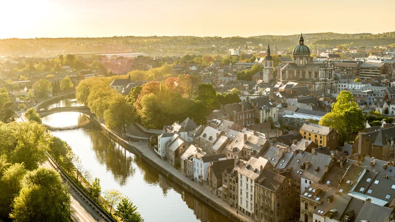Explore the city of Namur, golden in the sunset.