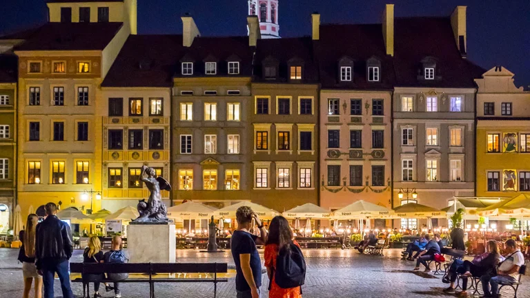 Warsaw old town with visitors on it.
