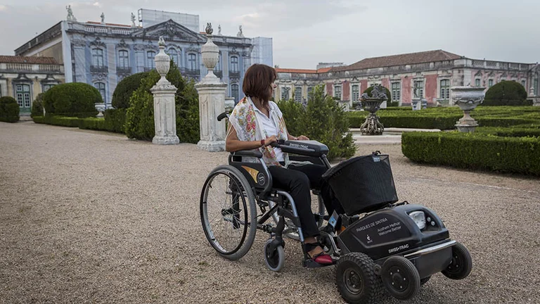Cover longer distances using a Swiss-Trac, a motorized device you can attach in front of a wheelchair.