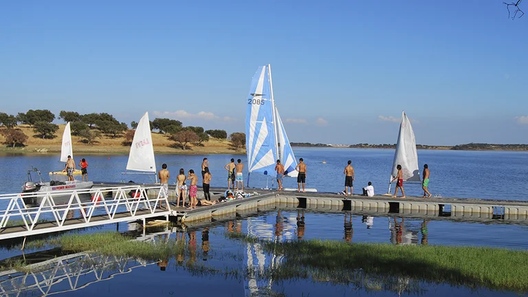 People preparing sailboats on Alqueva Lake, Portugal.