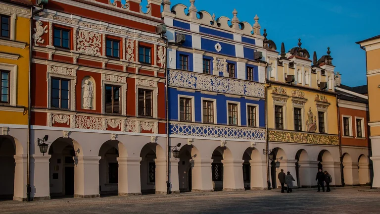 Colourful Renaissance townhouses with arcades in a historic European market square