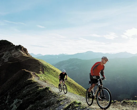 Bikers on the mountain track in Switzerland