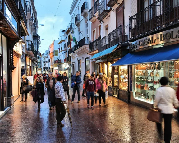People visit shopping area in Seville