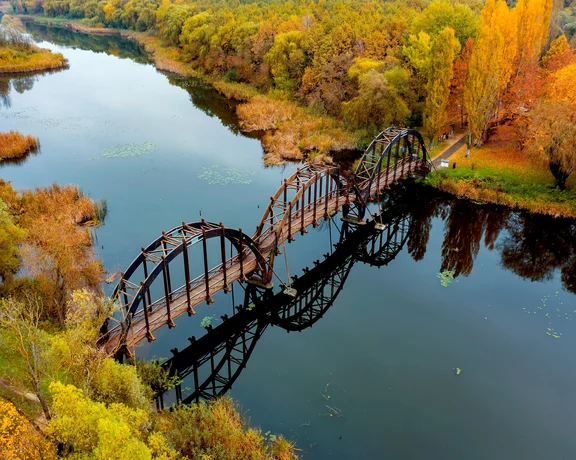 Cross the bridge to Kányavári Island. Can you see its reflection?