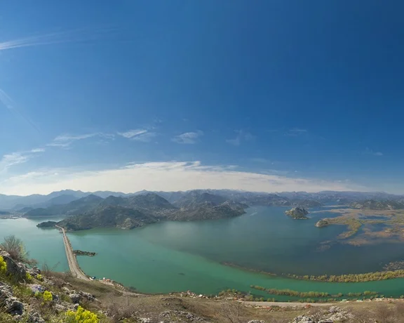 Marvel at the amazing landscape of Skadar Lake with unforgettable blue sky and emerald water.
