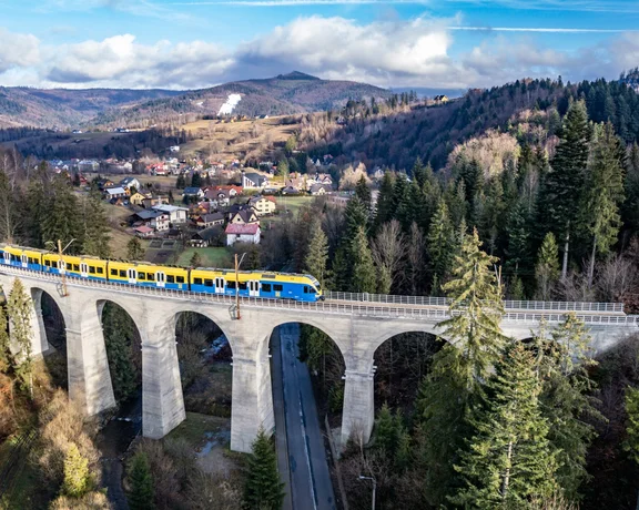 Get a great view of the Smržovka Jizera mountains as your cross over the railway viaduct.