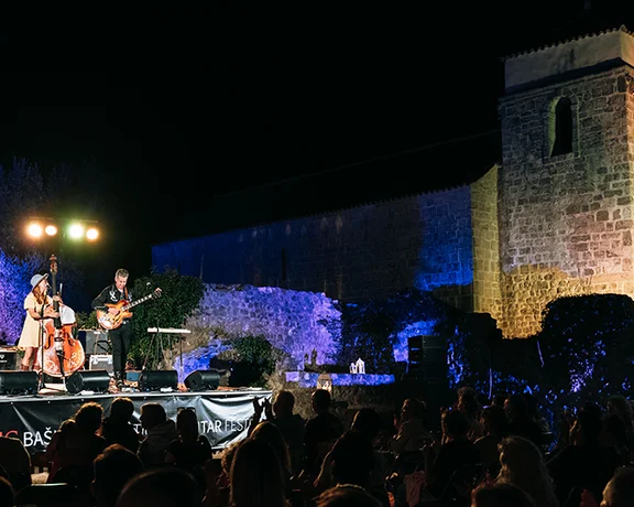 Settle under the walls of a castle to enjoy the beautiful sounds of the Baska International Guitar Festival.