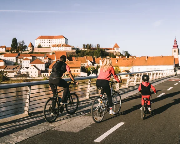 a family is visiting Ptuj by bike!